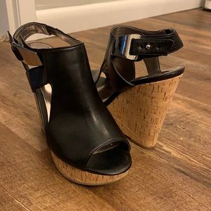 Carlos Santana black wedges size 7.